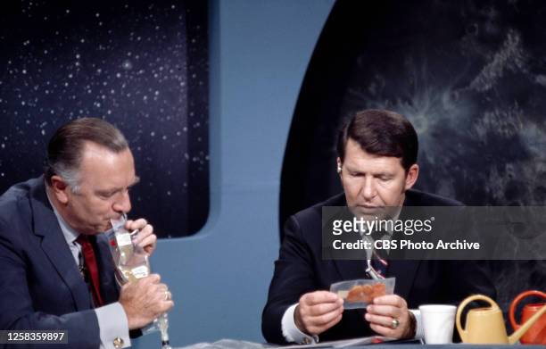 From left is CBS News reporter Walter Cronkite and NASA astronaut Wally Schirra, consultant and co-anchor on the broadcast. Grumman Aerospace at...