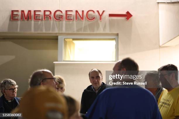 Dr. Dennis Fiddler greets supporters of the Minden emergency department who gathered for a candlelight vigil to honour the staff on their last shift...