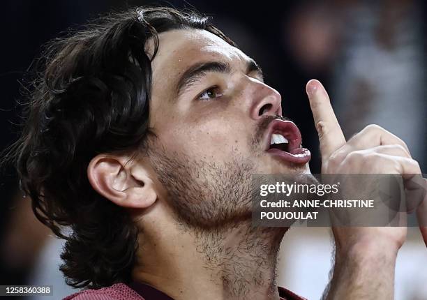 Taylor Fritz gestures after winning against France's Arthur Rinderknech at the end of their men's singles match on day five of the Roland-Garros Open...