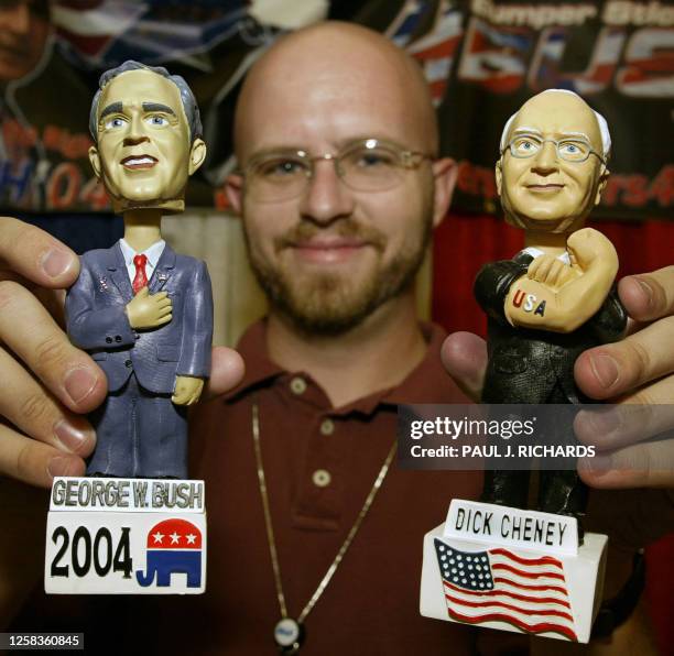 Dan Phoenix of Glendale, Arizona, holds up "bobble-head" dolls of US President George W. Bush and Vice President Dick Cheney he sells for 15 USD each...