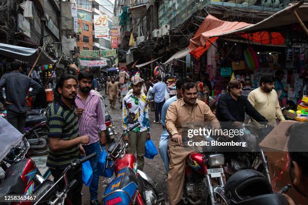 Motorists and shoppers at a street market in Lahore, Pakistan, on Thursday, June 1, 2023. Pakistan's inflation has hit another record high, making it...