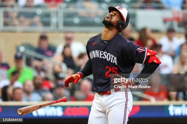 Byron Buxton of the Minnesota Twins reacts after getting hit by a pitch during the fourth inning against the Cleveland Guardians at Target Field on...