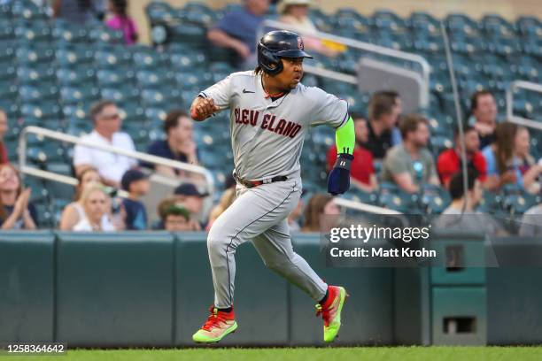 Jose Ramirez of the Cleveland Guardians rounds third base to score on a hit by Josh Bell during the sixth inning against the Minnesota Twins at...