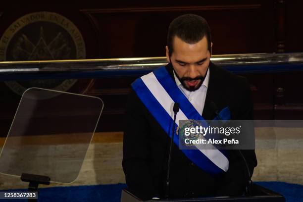Salvadoran President Nayib Bukele watch his speech during a report to the nation for his 4th anniversary of presidential administration in the...