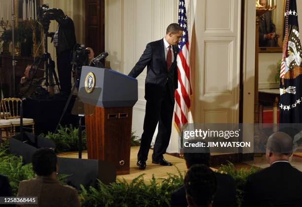 President Barack Obama steps away from the podium at the close of his first prime time press conference in the East Room of the White House in...