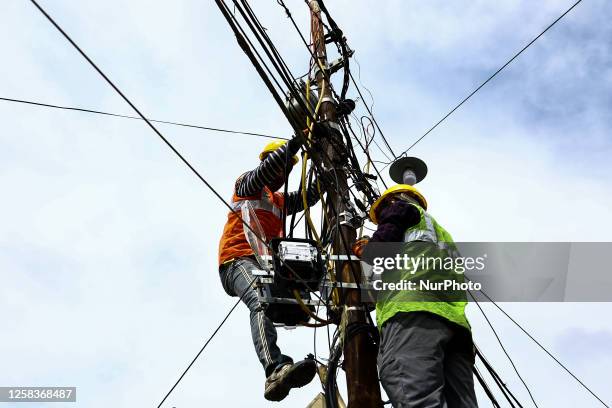 Workers install new Smart power meters in Sopore District Baramulla Jammu and Kashmir India on 02 June 2023.The protest against the installation of...