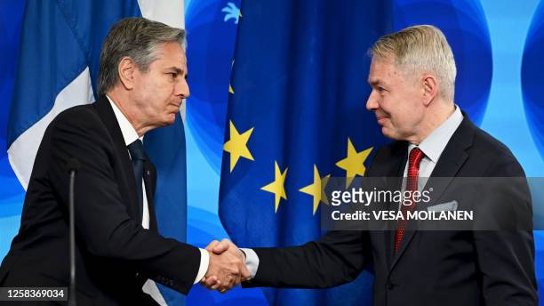 Secretary of State Antony Blinken and Finnish Foreign Minister Pekka Haavisto shake hands after signing a joint statement of Finland and the United...