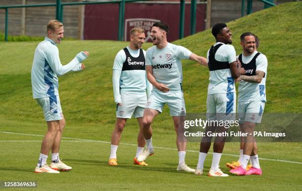 West Ham United's Declan Rice laughs with team mates during the training session at the Rush Green Training Ground, Romford. Picture date: Friday...