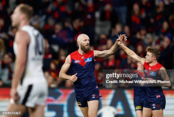 Max Gawn and Kade Chandler of the Demons celebrate during the 2023 AFL Round 12 match between the Melbourne Demons and the Carlton Blues at the...