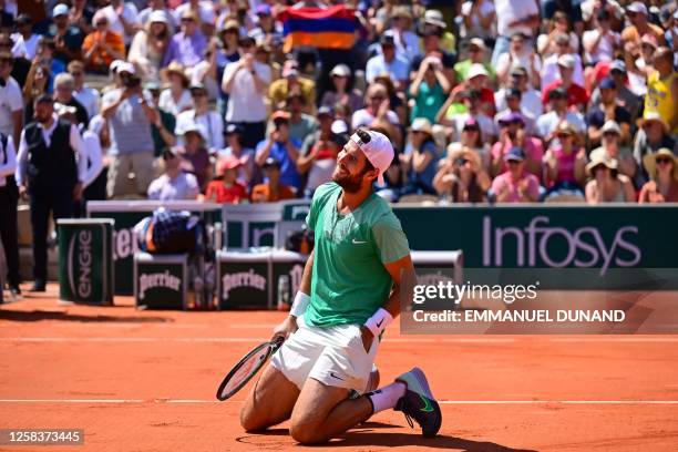 Russia's Karen Khachanov celebrates after winning against Australia's Thanasi Kokkinakis at the end of their men's singles match on day six of the...