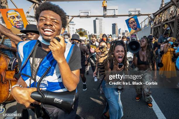 July 25: Livia Rose Johnson and Kiara Williams organization leaders of Warriors In the Garden use microphones and megaphones to lead the protesters...