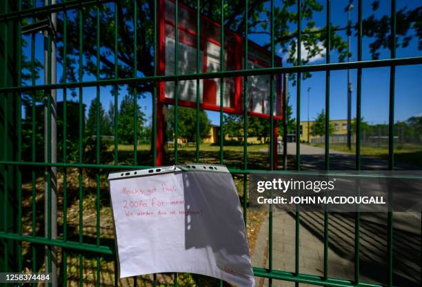 Message of support hangs on June 2 on the fence of the sports ground where Berlin football club JFC trained in Berlin. A 15-year-old footballer from...