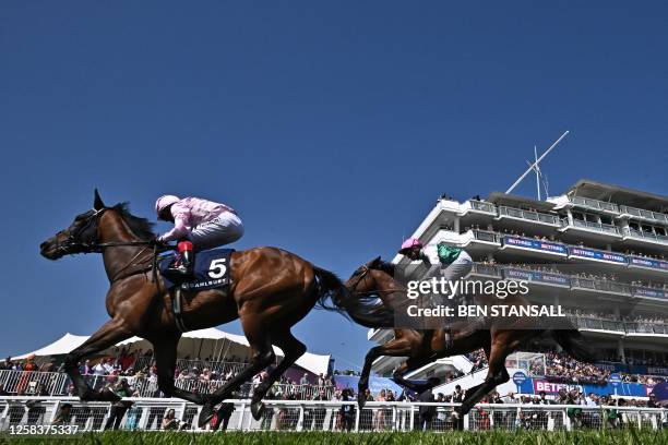 Jockey Frankie Dettori rides Emily Upjohn to victory in the Coronation Cup on the first day of the Epsom Derby Festival horse racing event in Surrey,...