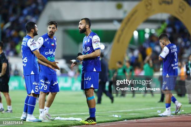 Rouzbeh Cheshmi of Esteghlal FC speaks with Aref Gholami of Esteghlal FC after the Hazfi Cup match between Persepolis FC and Esteghlal FC on May 31,...