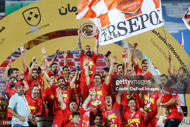 Milad Sarlak of Persepolis raise the trophy after the Hazfi Cup match between Persepolis FC and Esteghlal FC on May 31, 2023 in Tehran, Iran.