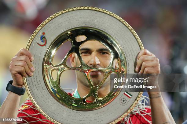 Issa Alekasir of Persepolis raise the trophy after the Hazfi Cup match between Persepolis FC and Esteghlal FC on May 31, 2023 in Tehran, Iran.