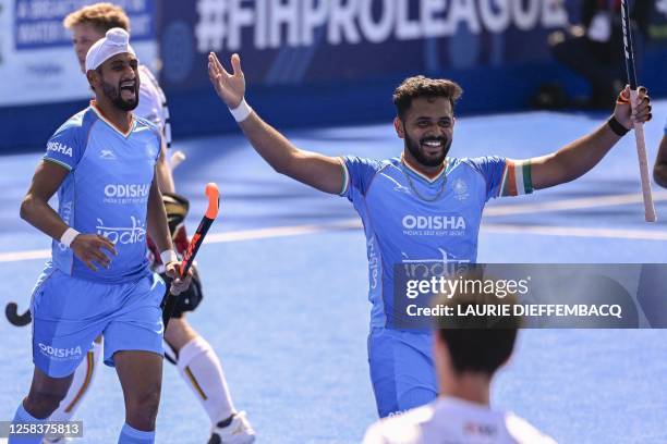 India's Harmanpreet Singh celebrates after scoring during a game between Belgium's Red Lions and India, the third match in the group stage of the...