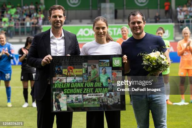Ralf Kellermann of VfL Wolfsburg, Julia Kassen of VfL Wolfsburg and Director of sport Marcel Schaefer of VfL Wolfsburg stand next to each other at...