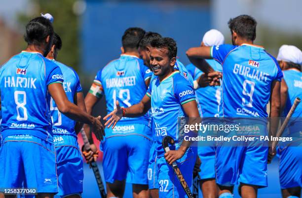 India's Prasad Vivek Sager celebrates scoring the opening goal with his team mates during the FIH Hockey Pro League match at Lee Valley, London....