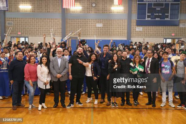 El Fantasma and Francisco "Paco" Fuentes pose with students and faculty at the Latin GRAMMY In The Schools educational program at Sidney Lanier High...