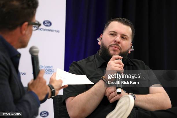 El Fantasma speaks onstage at the Latin GRAMMY In The Schools educational program at Sidney Lanier High School on May 24, 2023 in San Antonio, Texas.