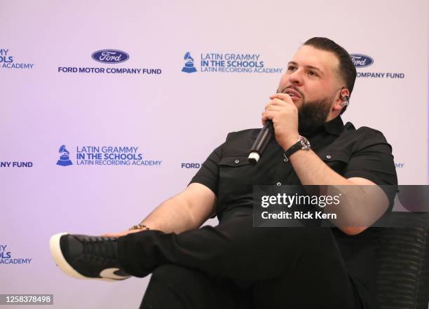 El Fantasma speaks onstage at the Latin GRAMMY In The Schools educational program at Sidney Lanier High School on May 24, 2023 in San Antonio, Texas.