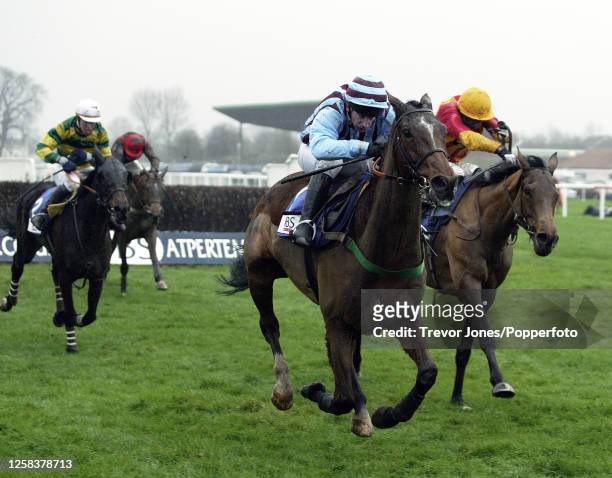 Irish Jockey Jim Culloty riding Edredon Blue winning the King George VI Chase at Kempton Park, 26th December 2003. Placed second Jockey Tony McCoy...
