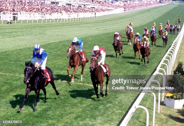 Jockey Willie Carson riding Erhaab winning the Derby at Epsom, 1st June 1994. Placed second Irish Jockey Mick Kinane riding King's Theatre , placed...