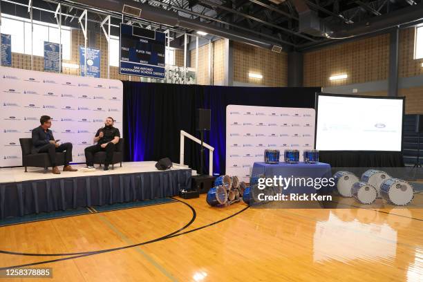 Francisco "Paco" Fuentes and El Fantasma speak onstage at the Latin GRAMMY In The Schools educational program at Sidney Lanier High School on May 24,...