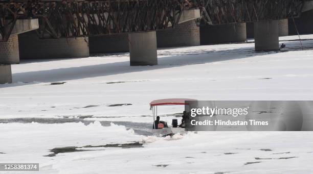 View of the toxic foam floating on the Yamuna water near ITO, on June 2, 2023 in New Delhi, India. The hazardous foam floating on the Yamuna is a...