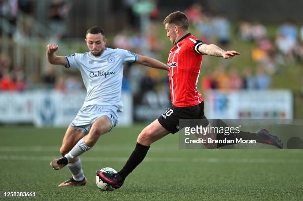 Derry , United Kingdom - 2 June 2023; Patrick McEleney of Derry City is tackled by Kyle Robinson of Shelbourne during the SSE Airtricity Men's...