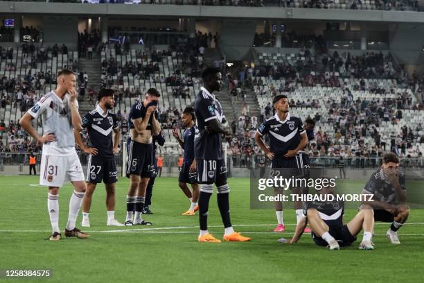 Bordeaux's players react after the French L2 football match between FC Girondins de Bordeaux and Rodez was abandoned by the referee, at Nouveau Stade...