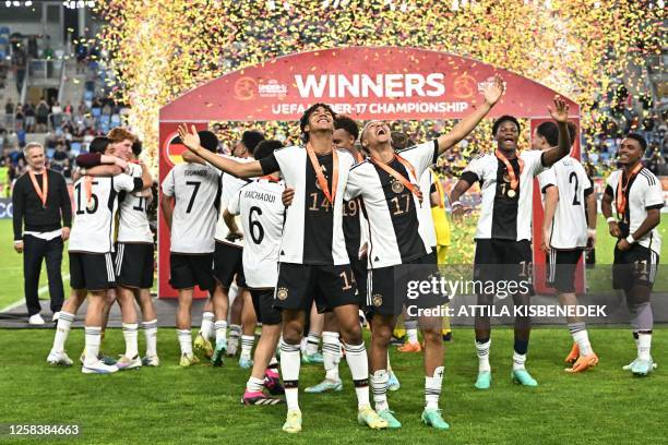 Germany's players celebrate after winning the UEFA Under 17 final football match between Germany and France at the Hidegkuti Nandor Stadium in...
