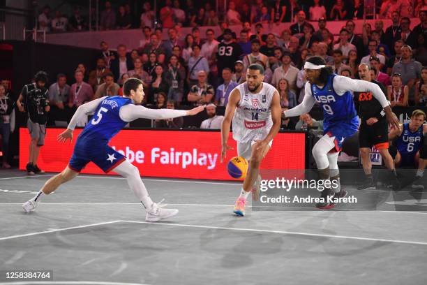 Jimmer Fredette of the USA, Nico Kaltenbrunner of Austria and Kareem Maddox of the USA fight during the mens pool play match between Austria and the...