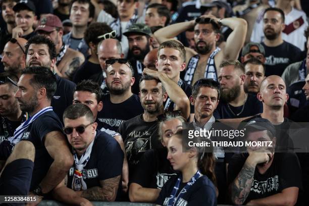 Fans react after the French L2 football match between FC Girondins de Bordeaux and Rodez was abandoned by the referee, at Nouveau Stade de Bordeaux...