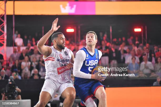 Nico Kaltenbrunner of Austria vies with Jimmer Fredette of the USA during the mens pool play match between Austria and the USA on Day 4 of the FIBA...