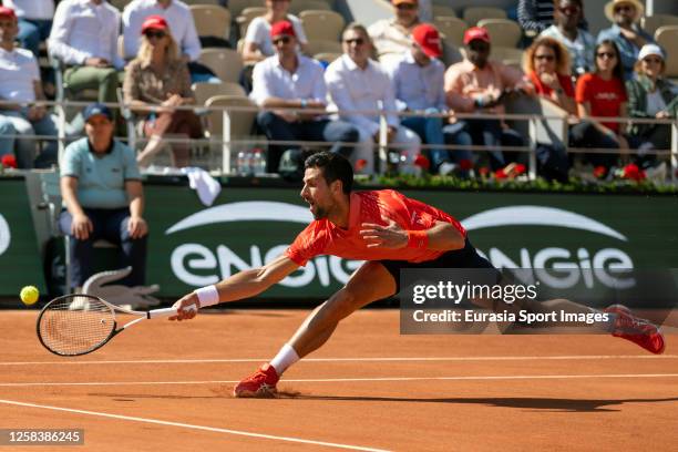 Novak Djokovic reaching for the ball after drop shot during his Singles Third Round Match against Alejandro Davidovich Fokina on Day Six of the 2023...