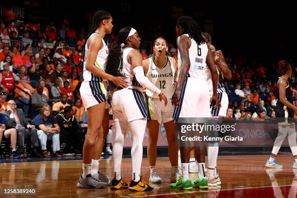 Dallas Wings huddle up on the court during the game against the Washington Mystics on June 2, 2023 at Entertainment & Sports Arena in Washington,...