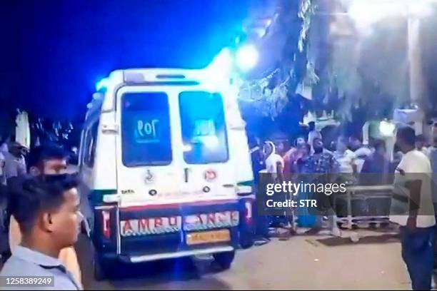 This frame grab taken from an AFPTV video footage on June 3, 2023 shows an ambulance arriving with an injured person to the Bhadrak District Hospital...