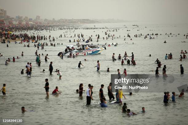 Palestinians enjoy the beach of the Mediterranean Sea on the coast of Gaza City, on June 2 during a heat wave.