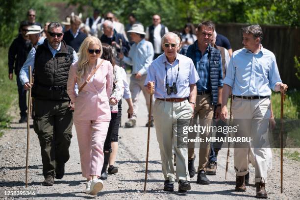 Britain's King Charles III walks down a street in the village of Valea Zalanului, 250 kilometers north of Bucharest, on June 3, 2023. Britain's King...