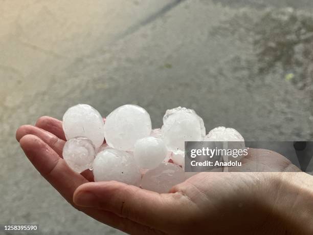 Person holds hail rain in Ankara, Turkiye on June 3, 2023. Downpour and hail rain that started at noon had a negative impact on life in Ankara.
