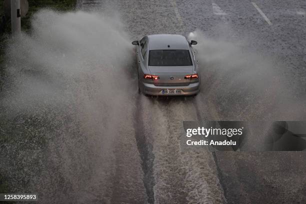 Vehicle wades through floodwaters after a downpour in Ankara, Turkiye on June 3, 2023. Drivers had a hard time due to the downpour that started at...