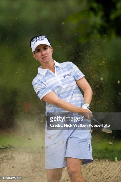 Karrie Webb of Australia plays out of a green-side bunker on the 6th hole during the final round of the Evian Masters at the Evian Resort Golf Club...