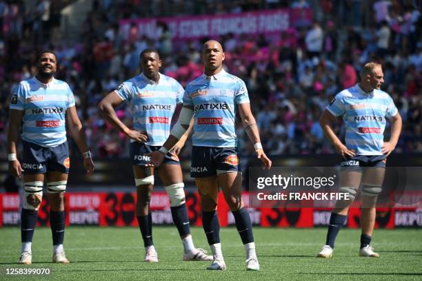 Racing 92's French wing Gael Fickou stands with teammates at the end of the French Top 14 playoff rugby union match between Stade Francais and Racing...