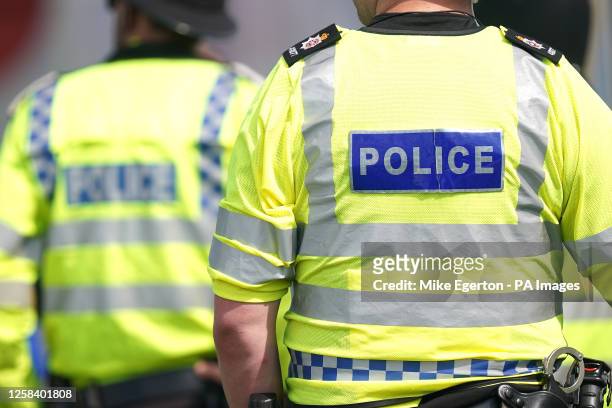 Police officers during Derby Day of the 2023 Derby Festival at Epsom Downs Racecourse, Epsom. Picture date: Saturday June 3, 2023.