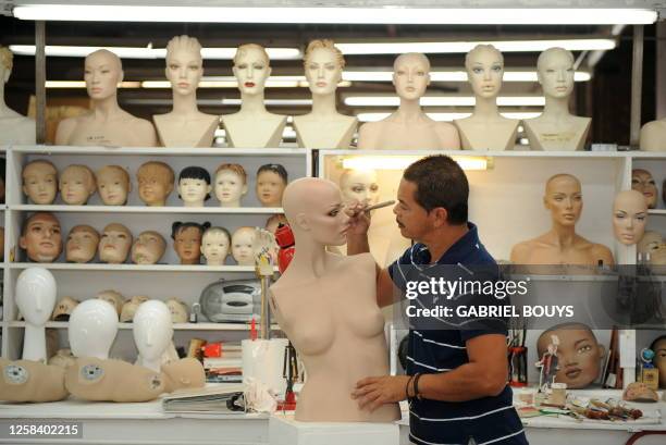 Man works on a mannequin at Patina V in City of Industry, California, on September 29, 2009. Patina V is a company providing mannequins for store...