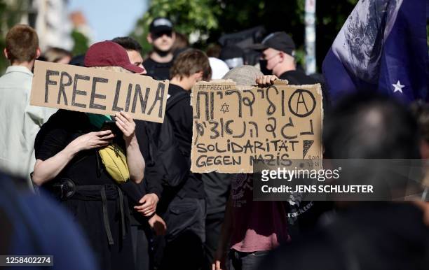 Demonstrators hold placards reading "Free Lina" and "Solidarity against Nazis!" during a so-called "national day of action" organised by far-left...