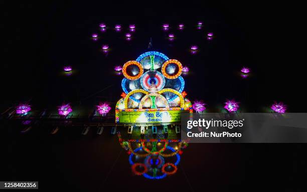 Night view of the pandal built on the river on June 3 in Ratnapura, Sri Lanka. Poson, also known as Poson Poya, is an annual festival held by Sri...