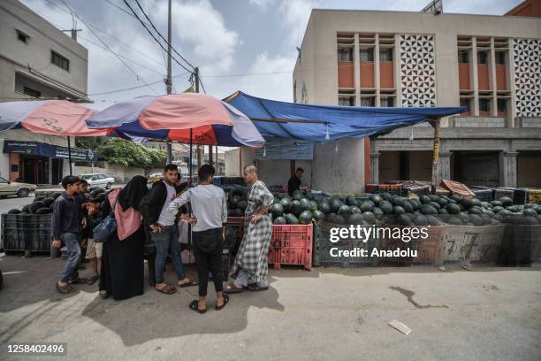 People buy watermelons as daily life continues in Gaza City, Gaza on June 03, 2023. With the increase in air temperatures, interest in watermelon,...